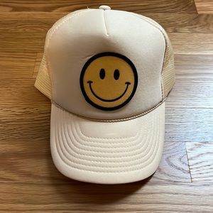Smiley face trucker hat. Sand.